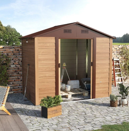Brown metal shed with open doors and blue sky