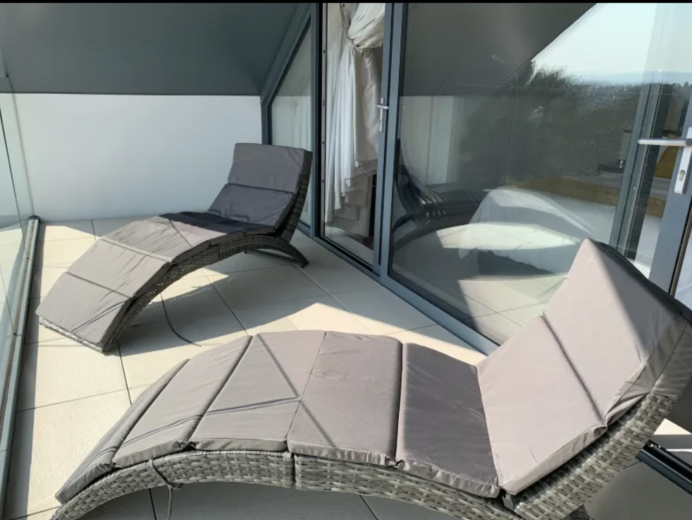 Grey Rattan Folding Sun Lounger with Cushion for Outdoor Relaxation