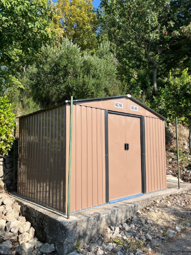 9ft x 6ft Outdoor Garden Storage Oasis with Foundation, Ventilation, and Rustic Brown Doors