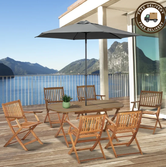 Wooden table and chairs under a parasol