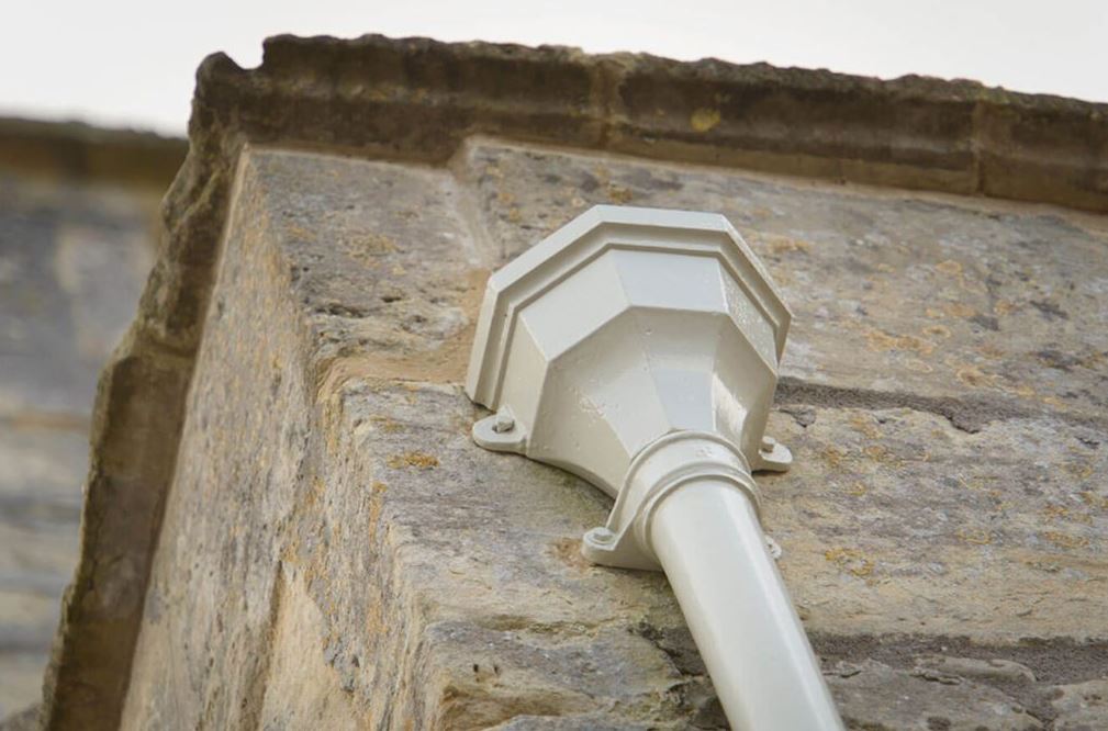 Cast Iron Guttering - White on a Building