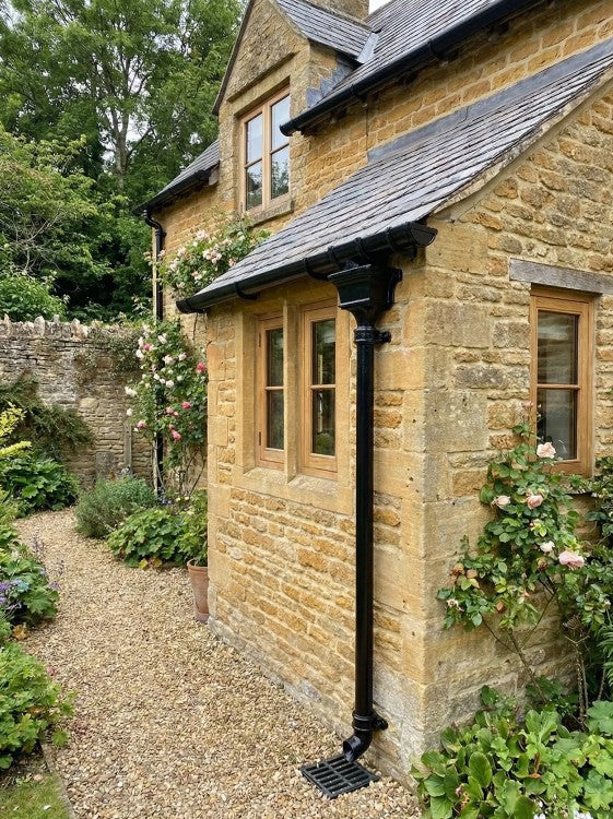 Cast Iron Guttering - White on a Building