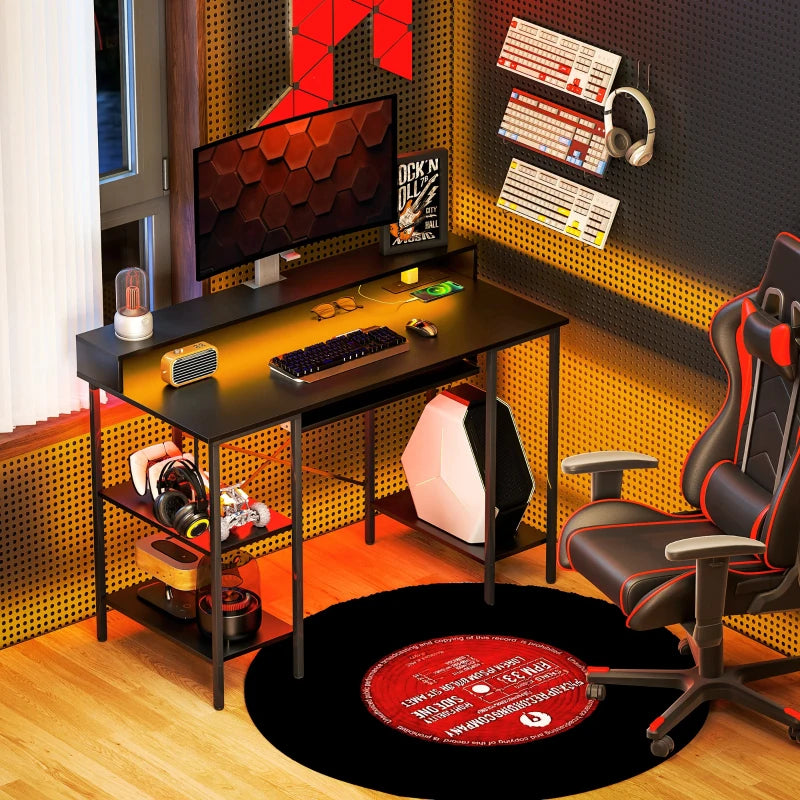 LED Gaming Computer Desk with Power Outlets, 120x55 cm, Monitor Stand, Sliding Keyboard Tray & Storage Shelves - Black